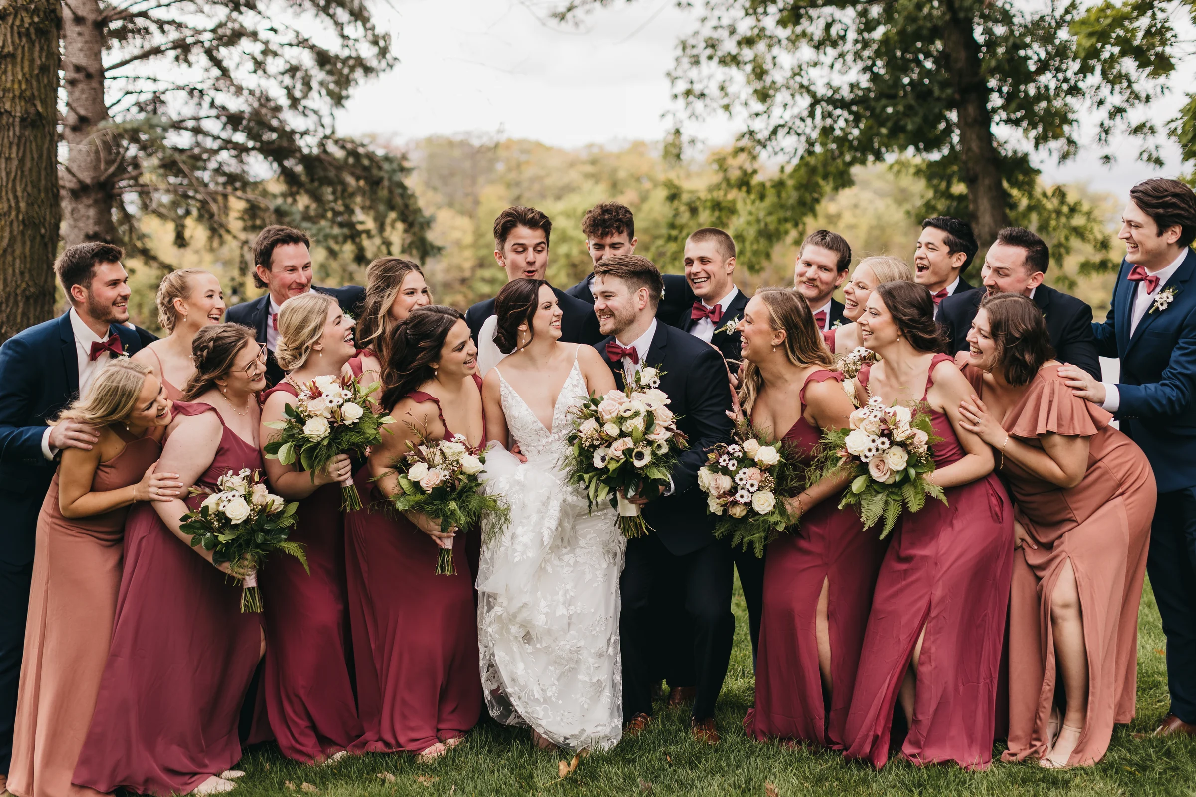 The wedding party gathered on the Chart House grounds in the trees
