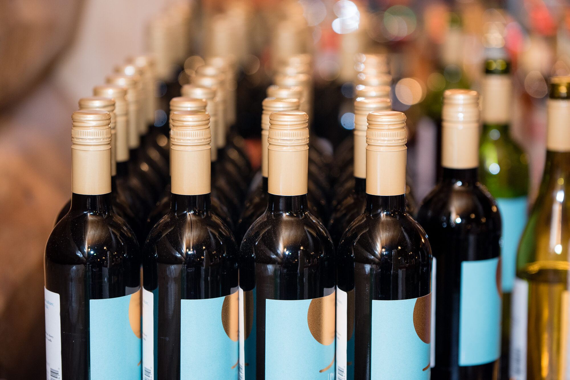Wine glasses lined up at a Fab! Weddings bar setup for a wedding reception