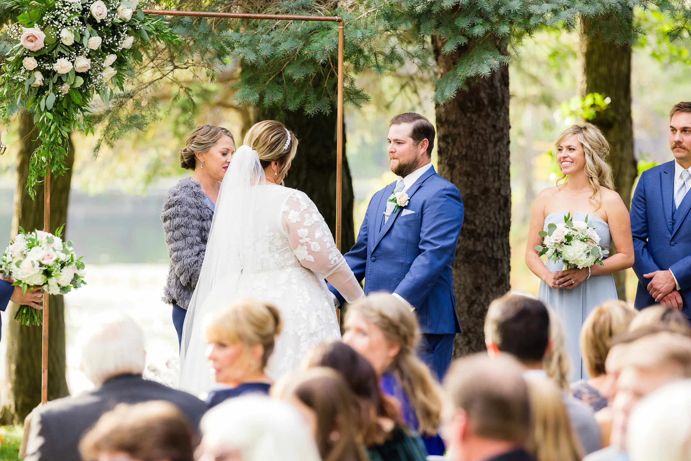Lakeside ceremony arch over Lake Kingsley in the wedding garden at the Chart House, Lakeville MN